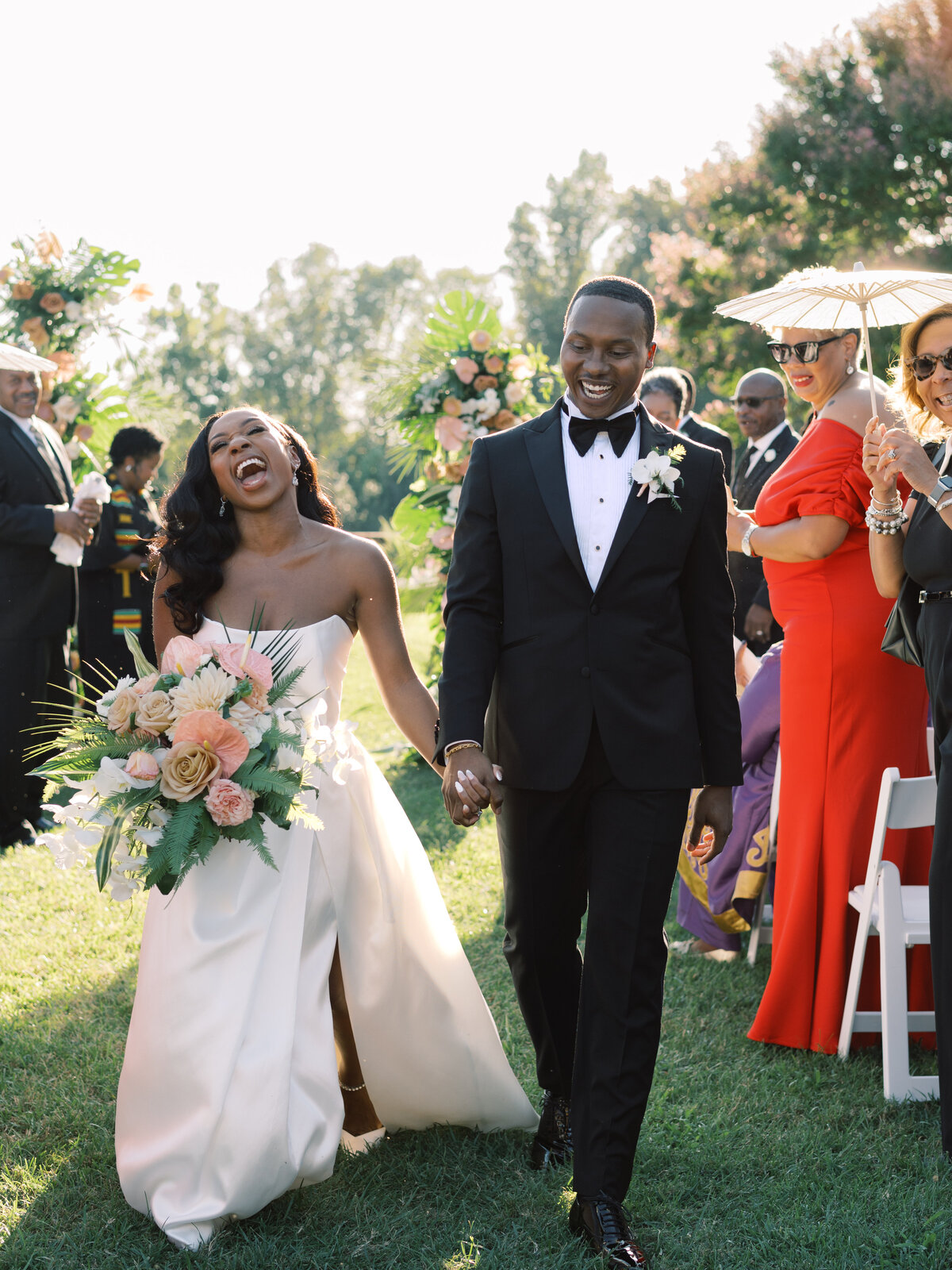 bride and groom happily walking down the aisle - photo by virginia wedding photographer