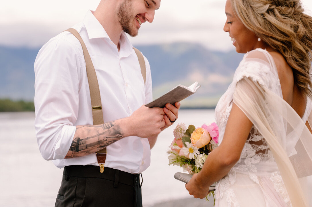 couple reading vows to each other