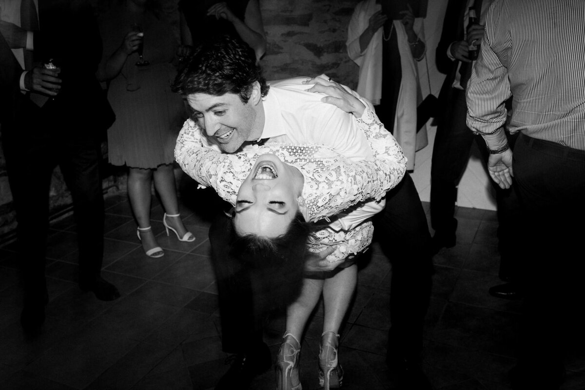 Man dipping woman on dance floor black and white