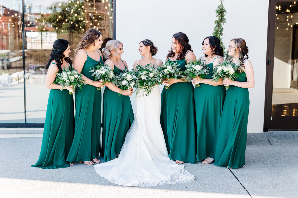 bride posing with bridesmaids at The Press Room in Knoxville