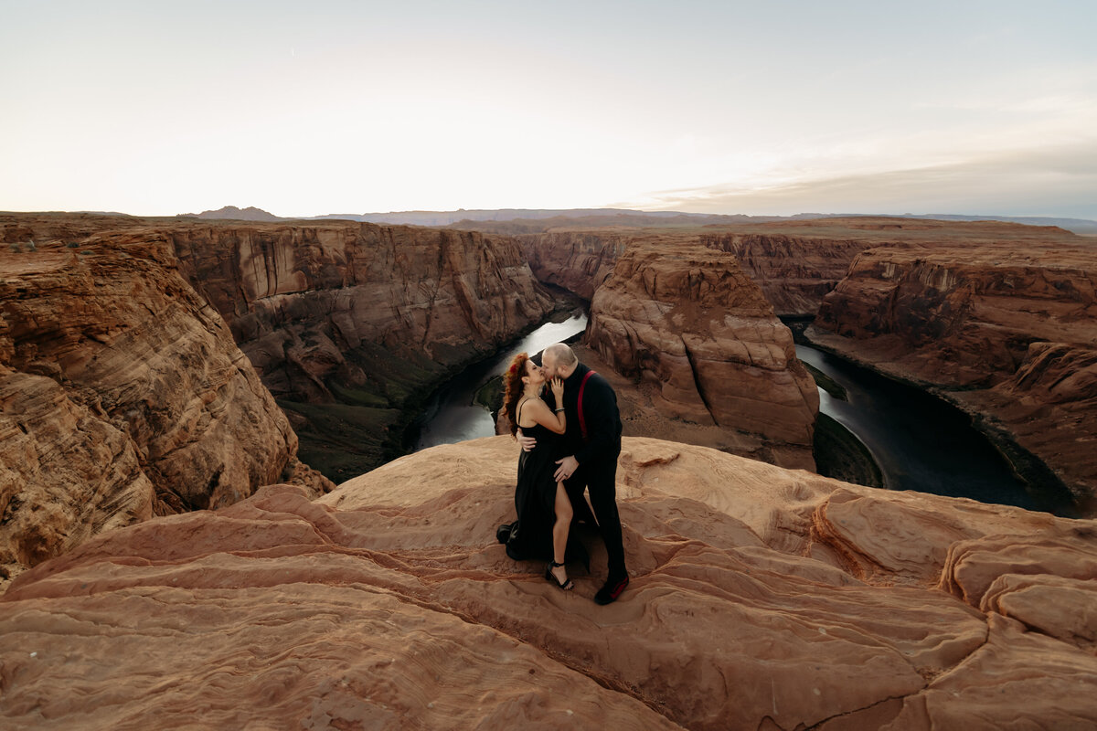 couple standing on cliff during destination elopement