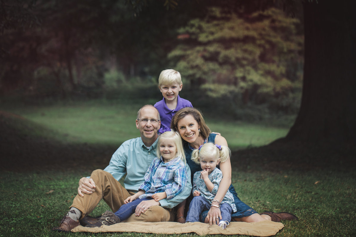 charlotte family photographer creates traditional fall family portrait with coordinated family and three children