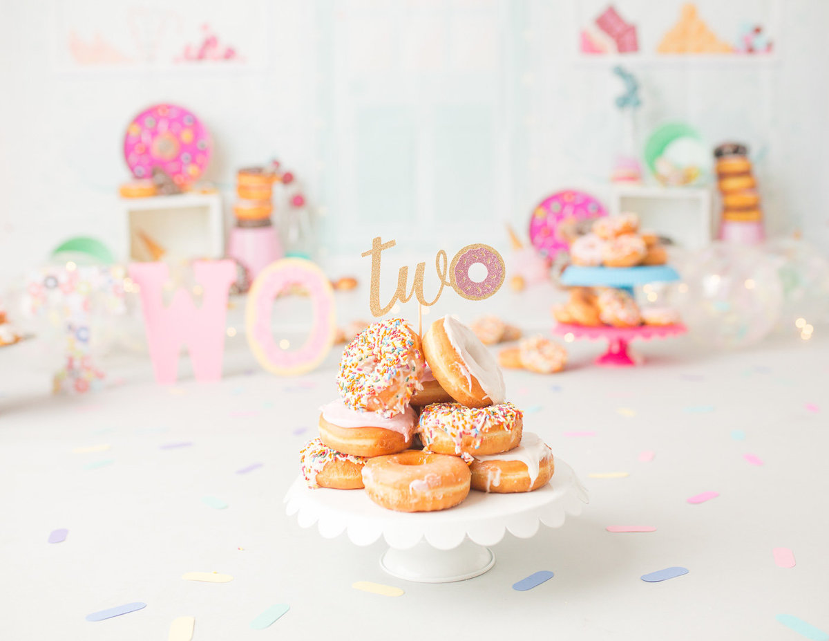 Custom donut-themed birthday cake smash photo taken in Rochester, NY.