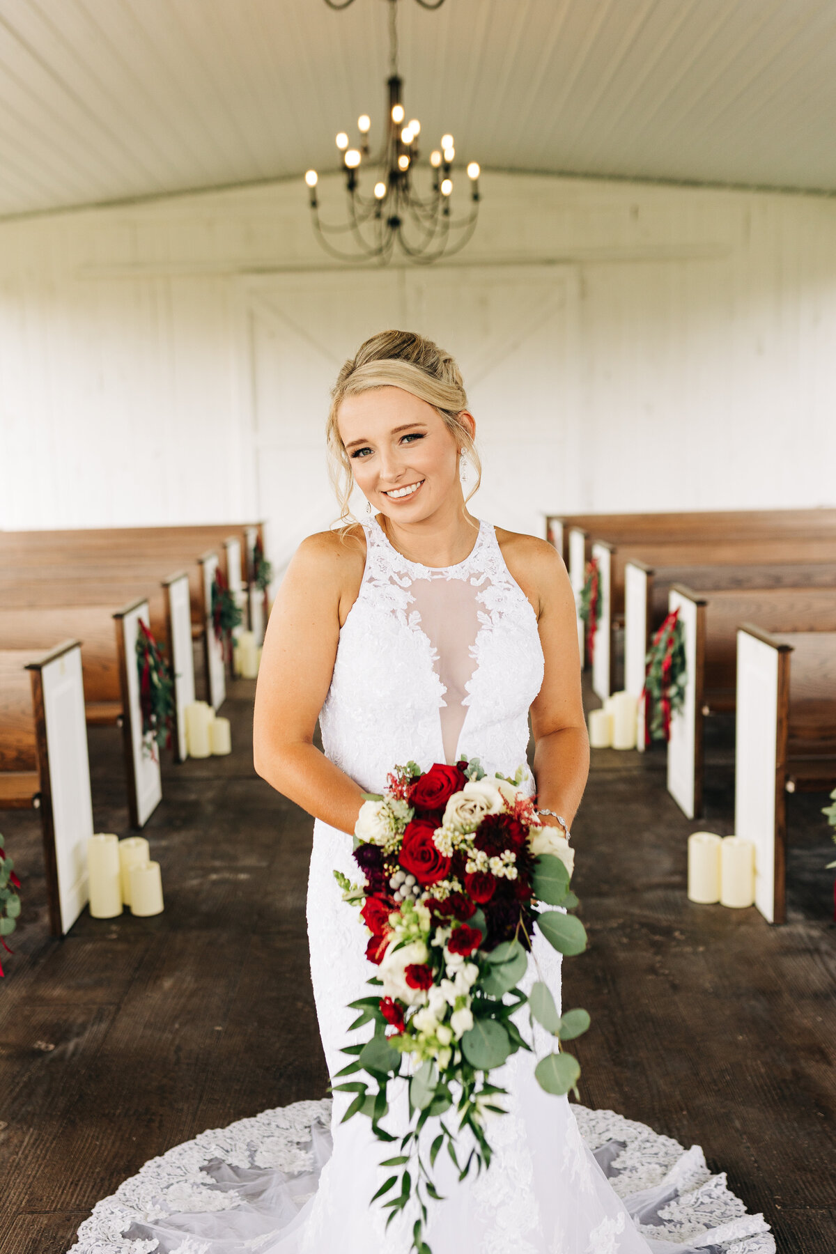 Bride holding red and green flowers