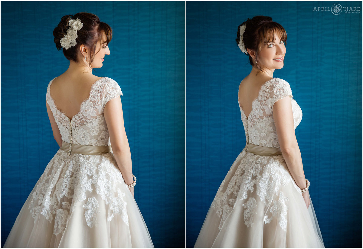 Bride poses for a portrait in front of the gorgeous blue wall in her hotel room in Cherry Creek Denver Colorado