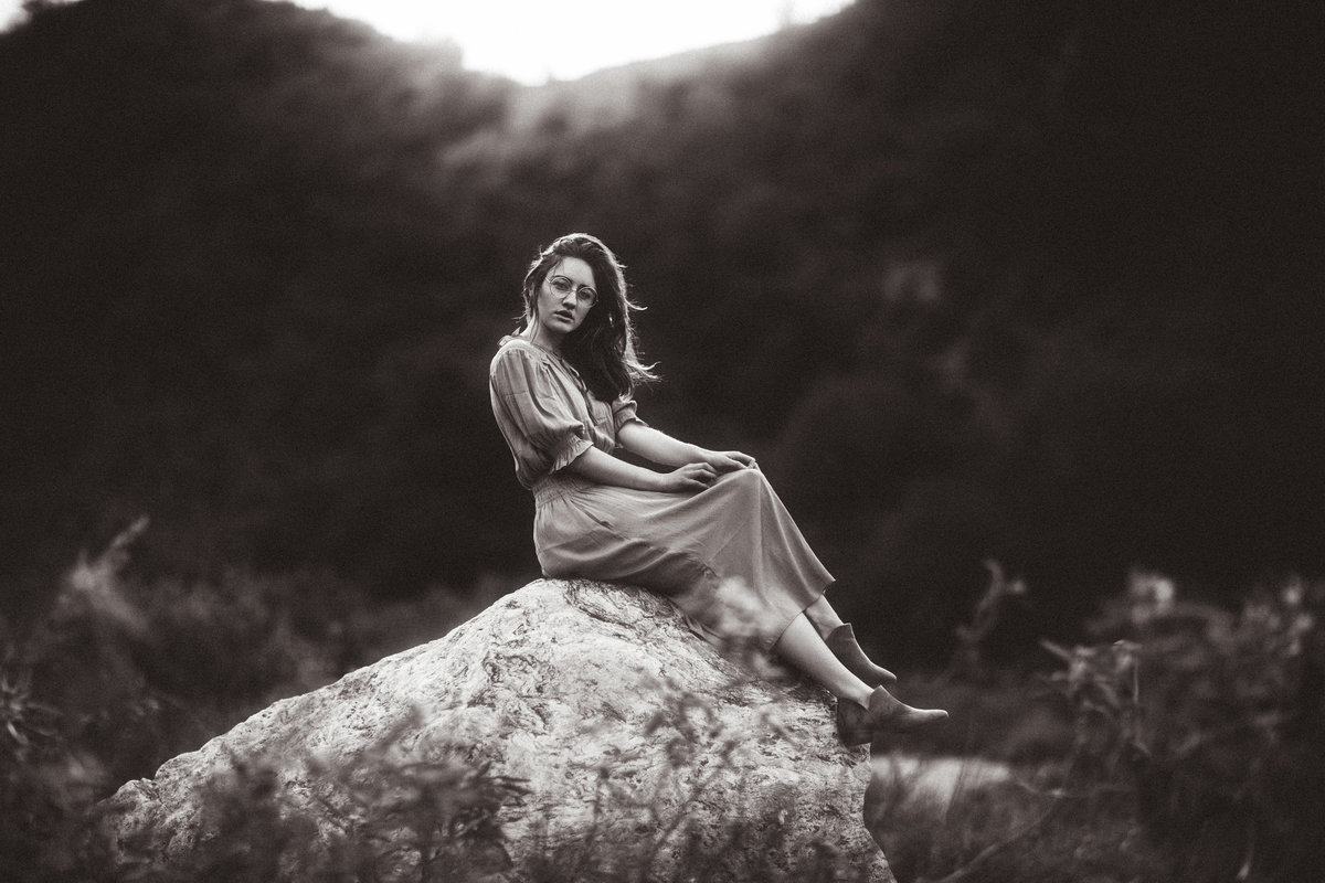 Portrait Photo Of Young Woman Seated On a Rock Black And White Los Angeles
