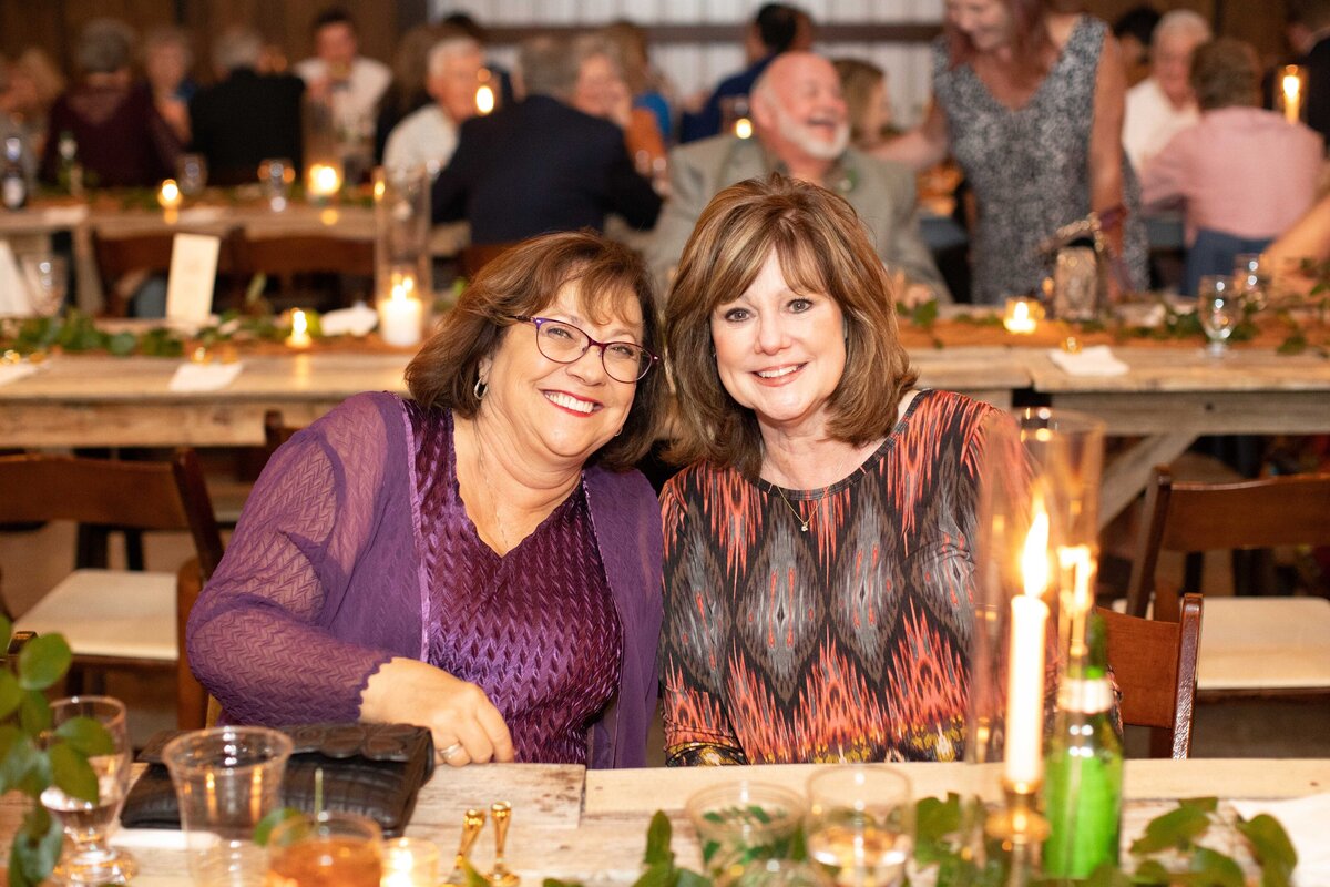 guests smile while at table at Allen Farmhaus wedding