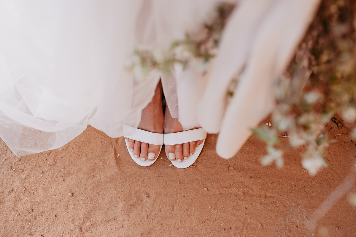 Utah elopement photographer captures bride wearing white wedding shoes