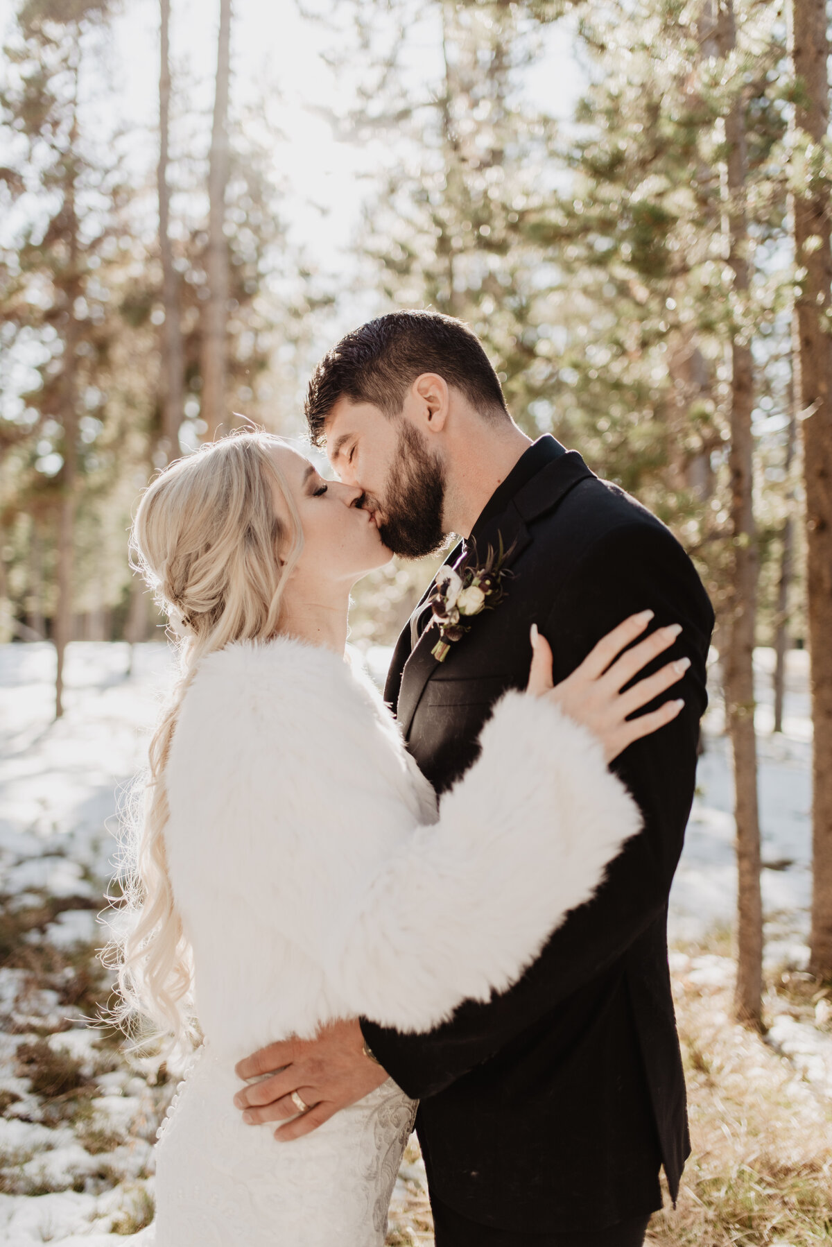 Jackson Hole Photographers capture couple kissing during bridal portraits