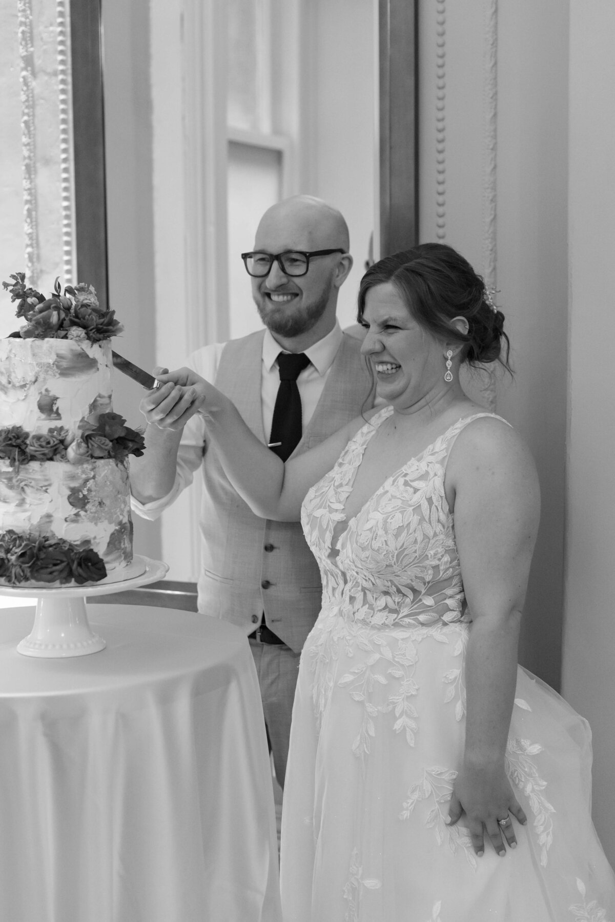 Bride and groom cutting wedding cake at  at Halifax Club wedding in Nova Scotia