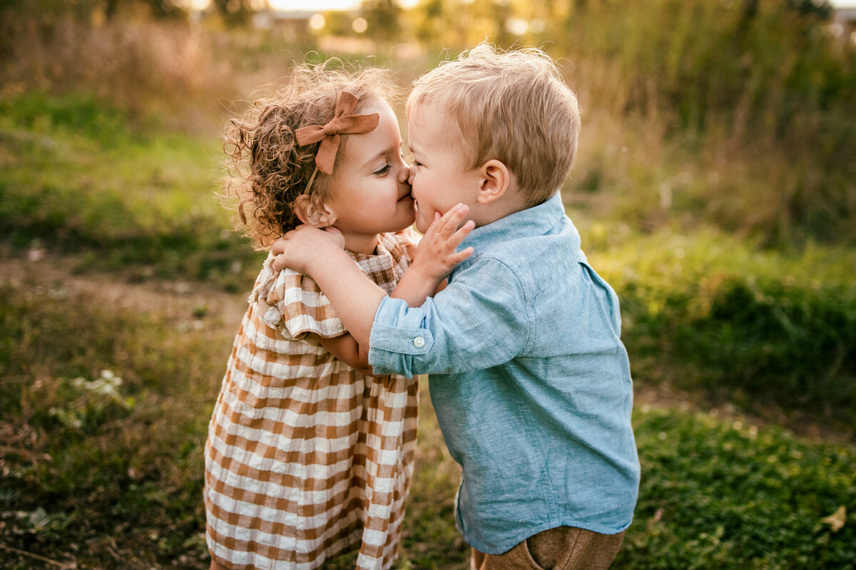 boy and girl hugging in park