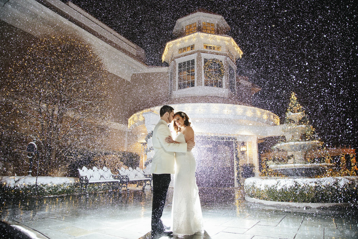 bride and groom in snow  at clarks landing yacht club