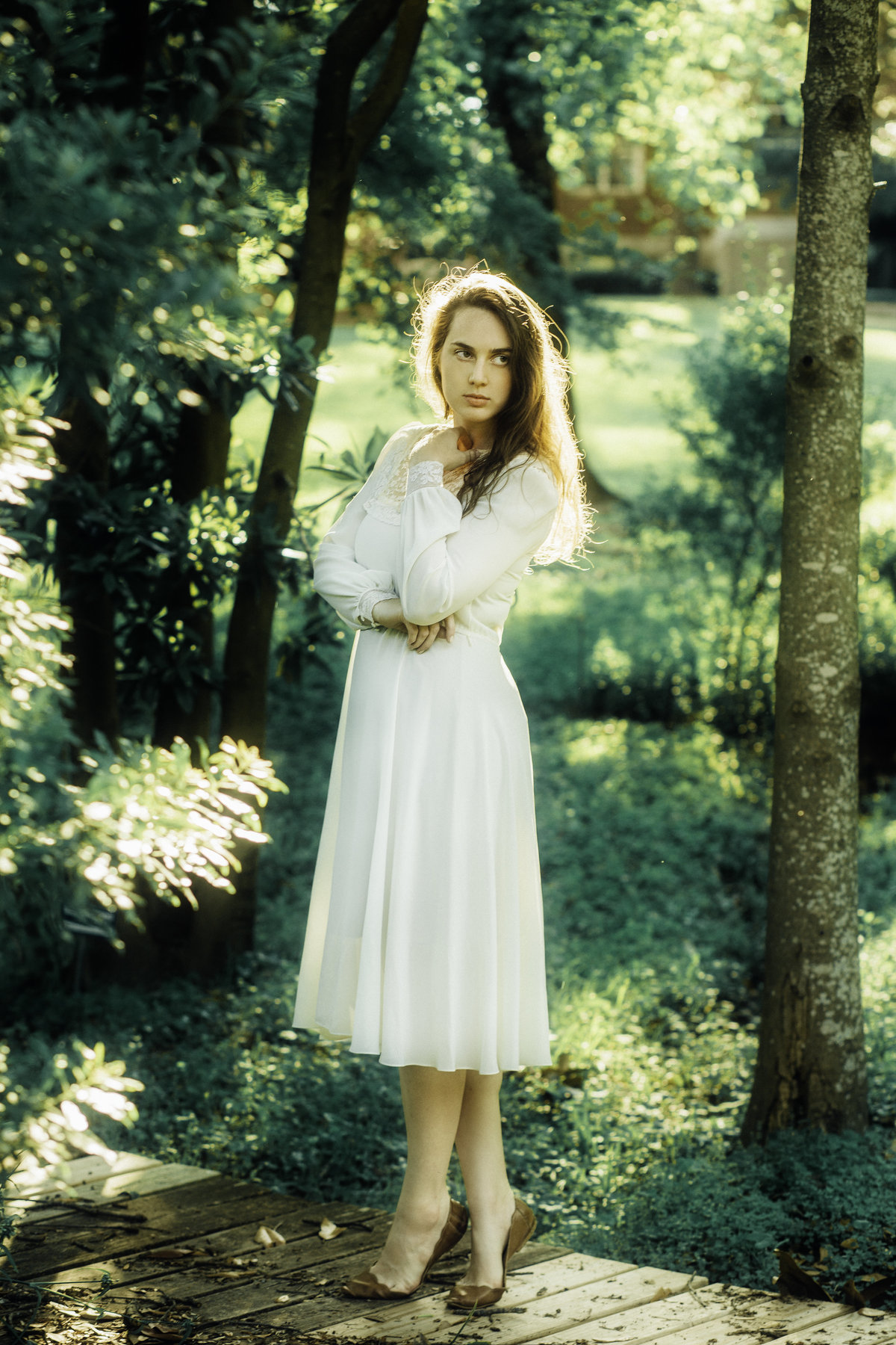 Portrait Photo Of Young Woman In White Dress In The Middle Of Trees Los Angeles