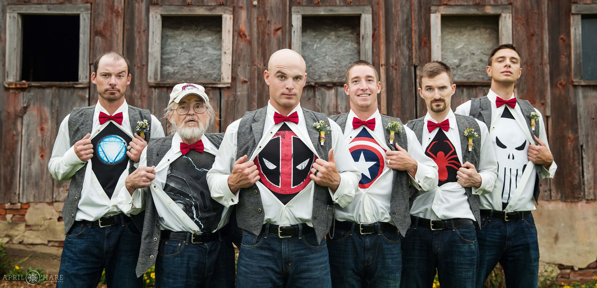 Fun groomsmen photo with secret superhero shirts on a Nebraska Farm