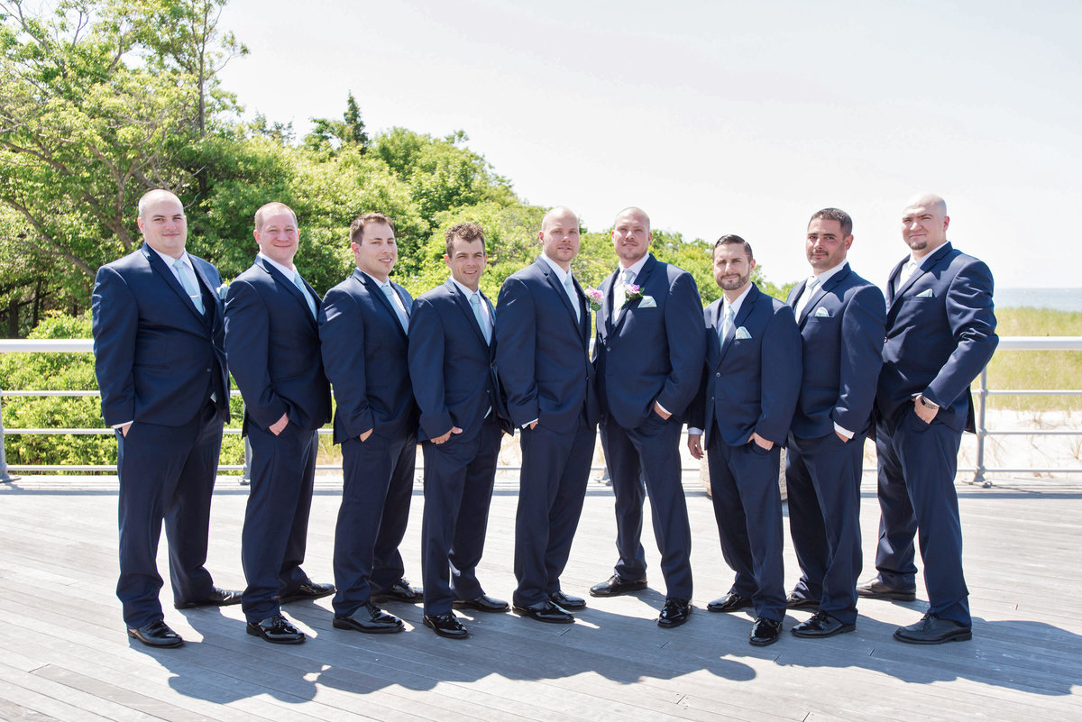 photo of groomsmen on the boardwalk from wedding at Pavilion at Sunken Meadow