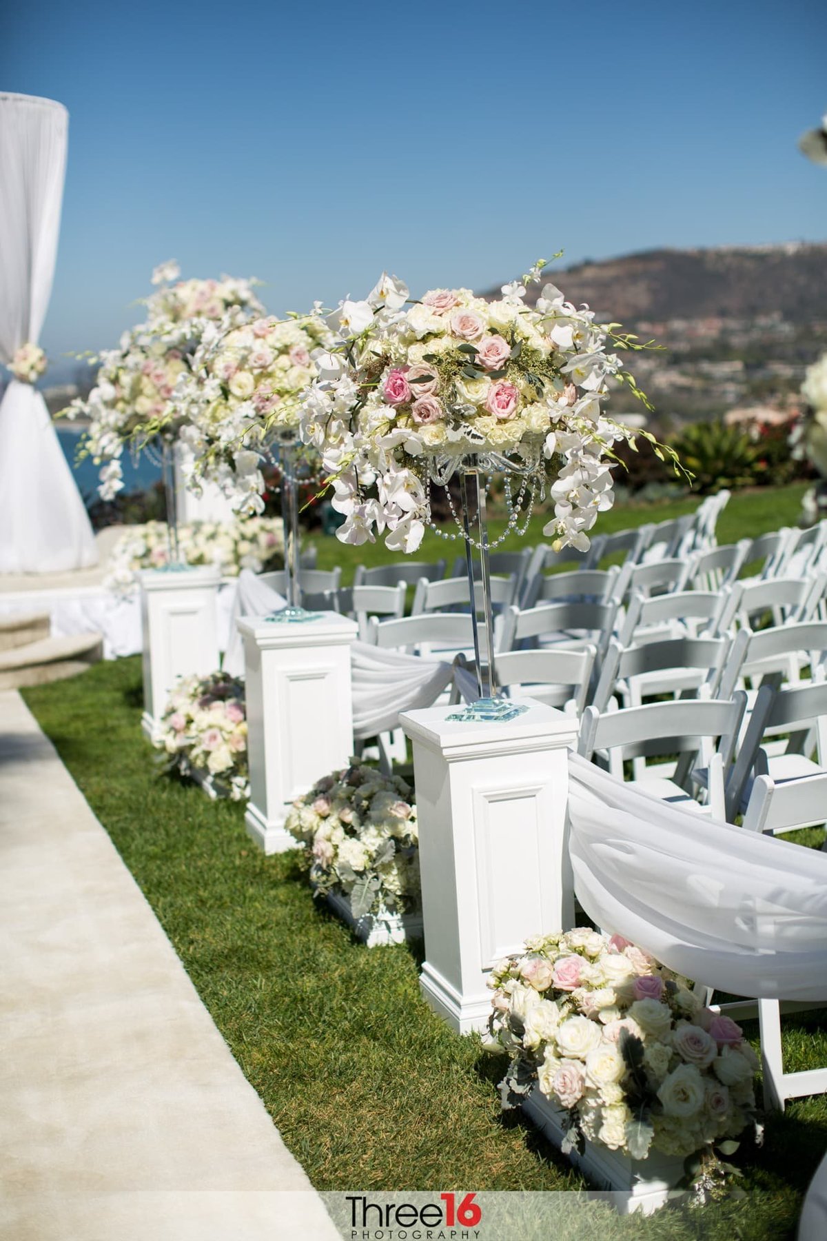 Floral arraignments amongst the wedding ceremony seating