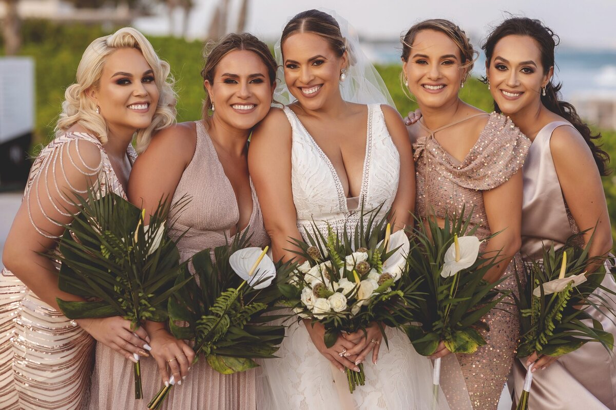 Close up of bride with bridesmaids at wedding in Riviera Maya Mexico
