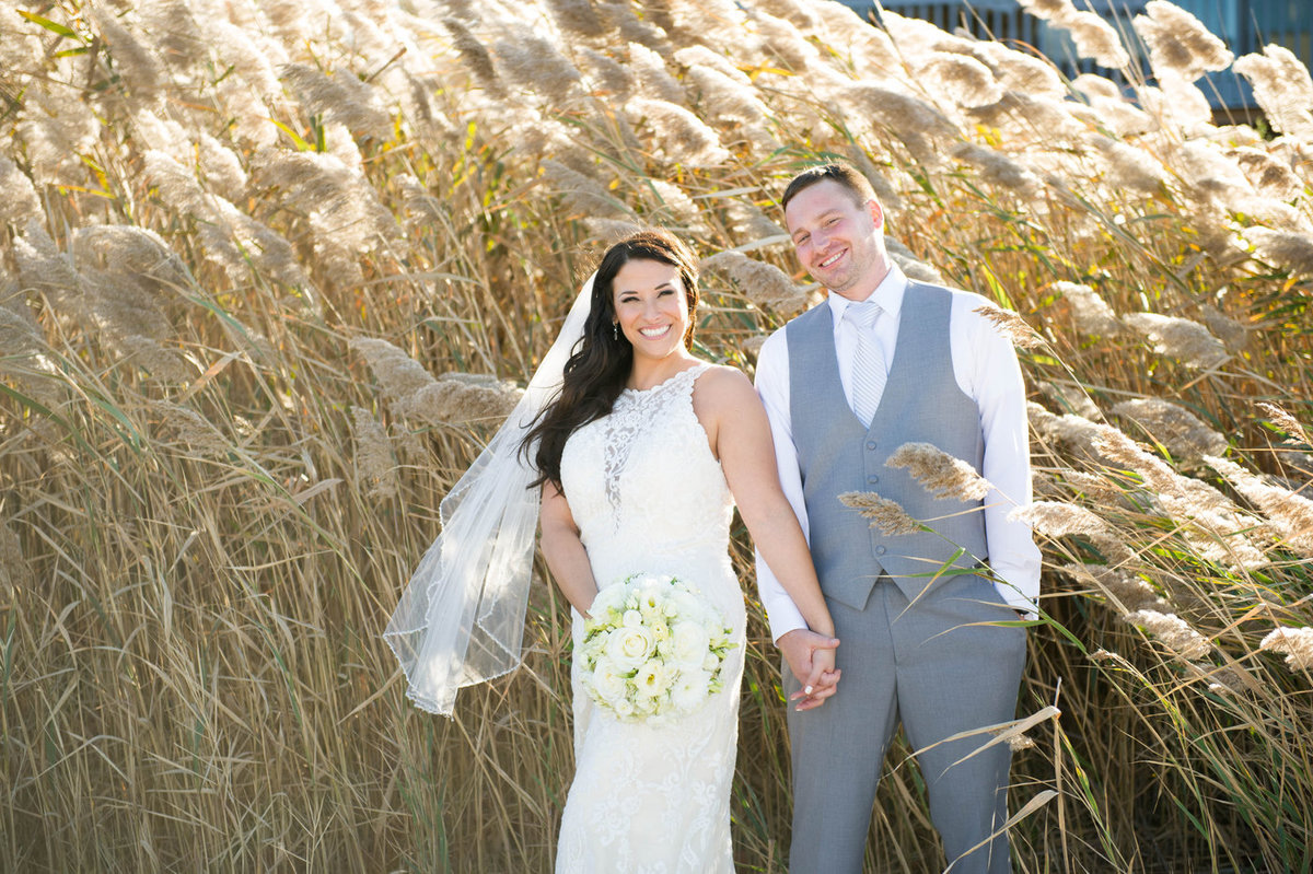 textured grasses with bride and groom