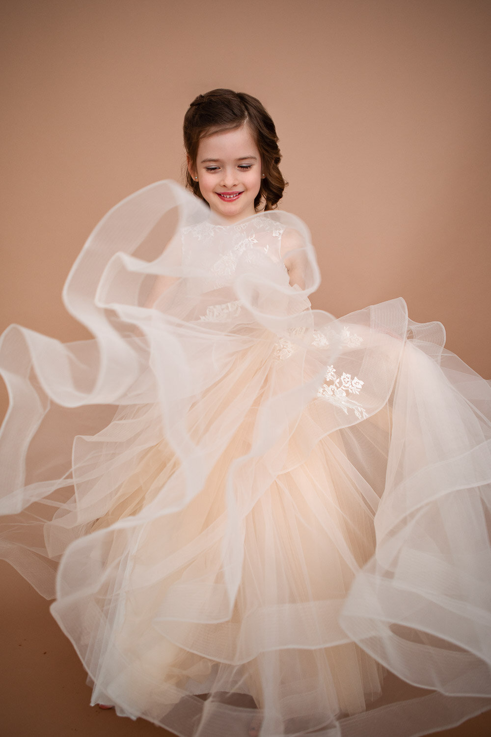Little girl spinning in a long dress