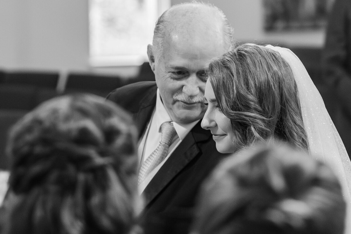 A father walking his daughter down the aisle in Cary by Raleigh wedding photographer, JoLynn Photography