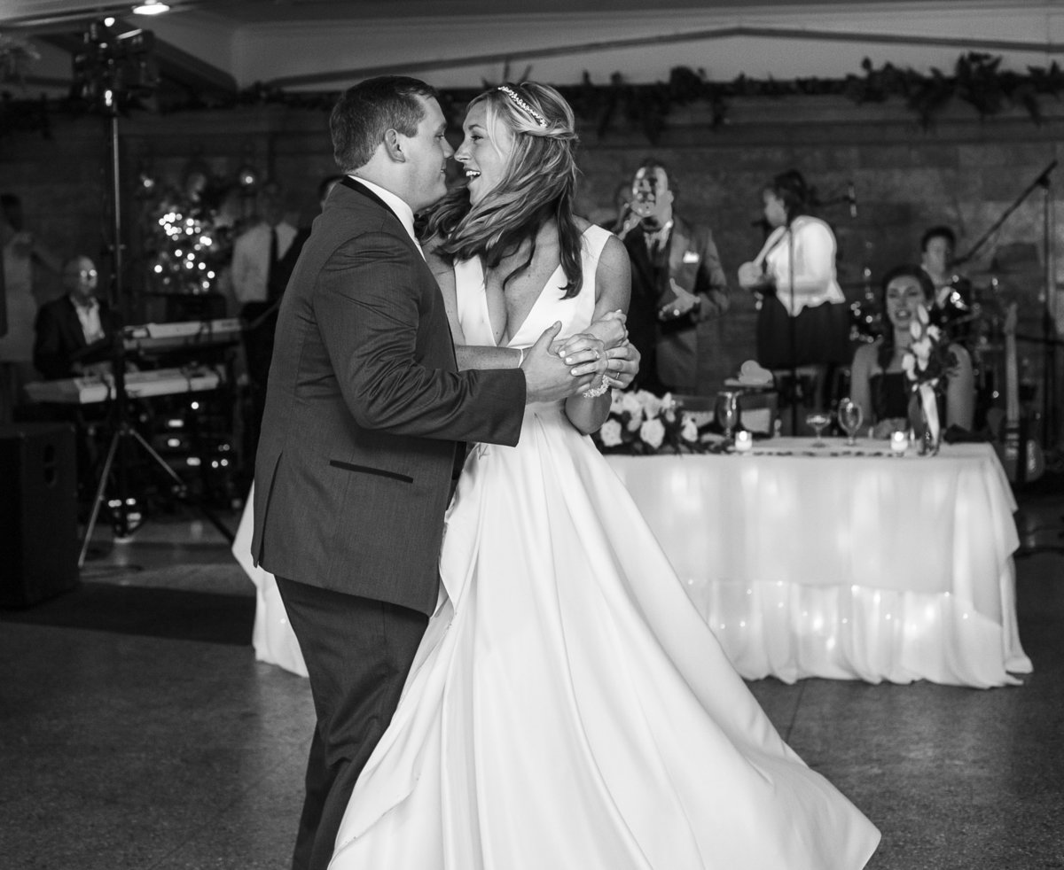 Bride and groom midtwirl of first dance at Masonic Temple wedding reception
