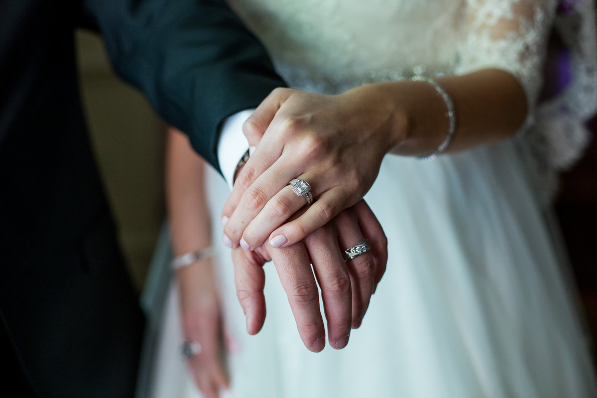 close up of bride and grooms hands with wedding rings on at down town wedding in San Antonio at The Westin Riverwalk venue