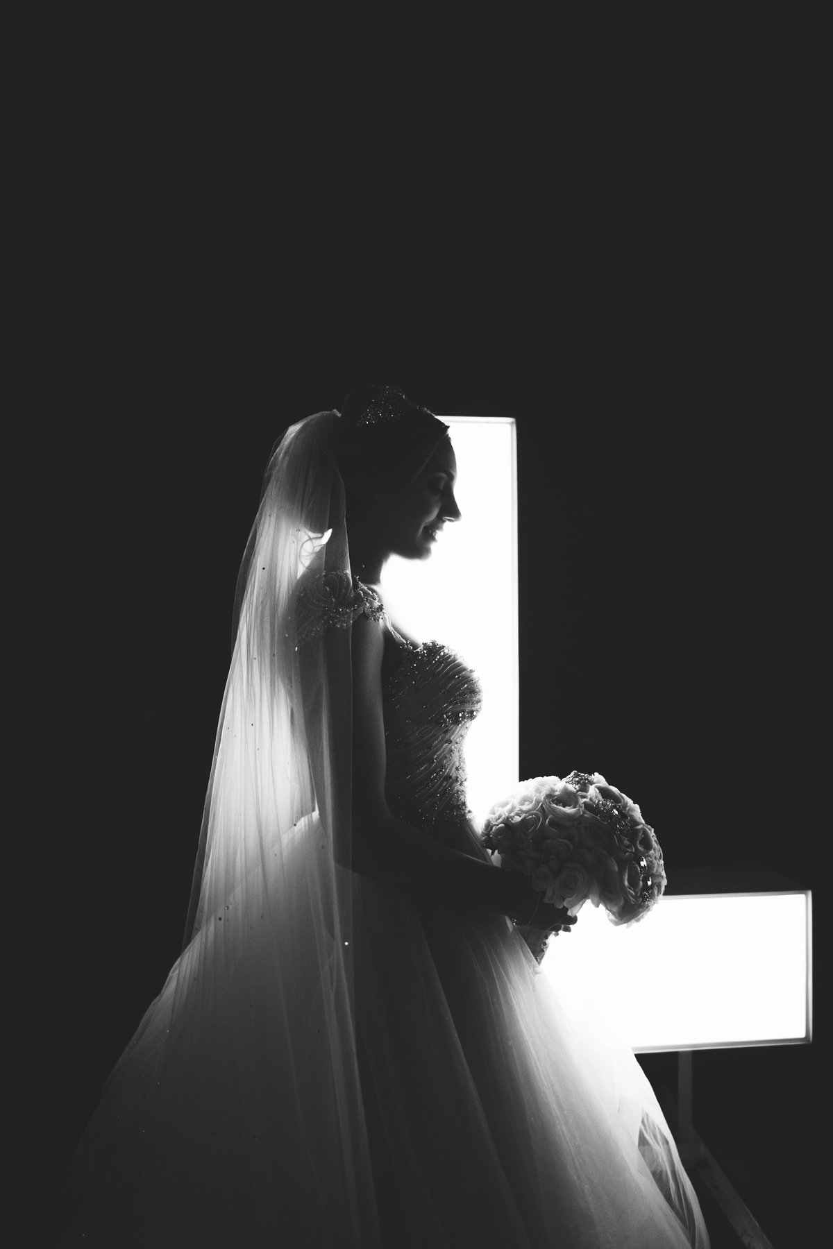 Bride silhouetter in front of the Love sign at Harbor Club