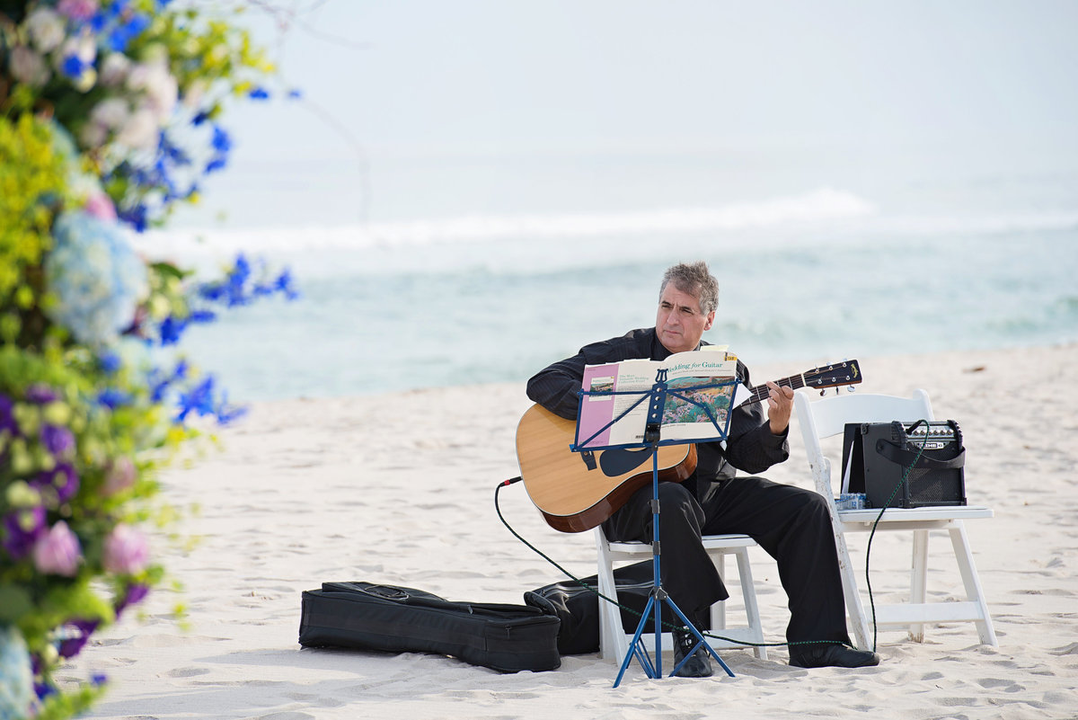 Wedding guitar player on the beach at Oceanbleu