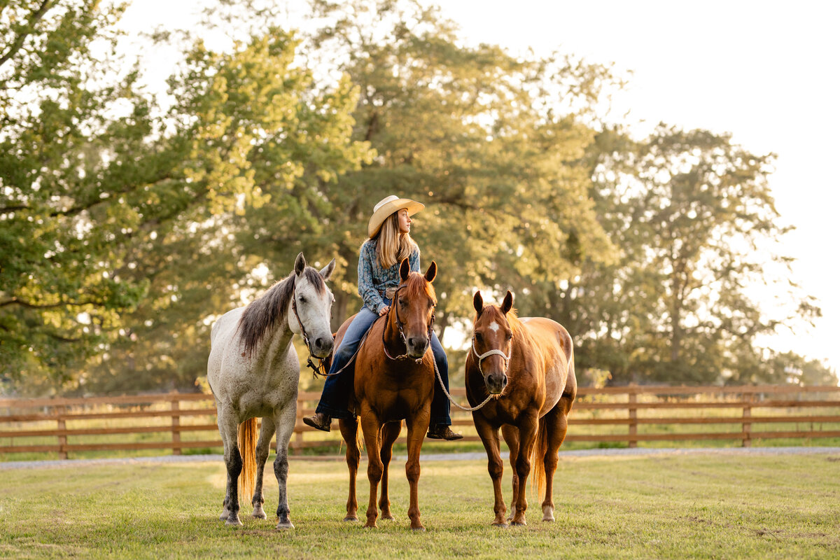 High School Rodeo in Alabama. Girl with her three horses photographed near Birmingham, Alabama.