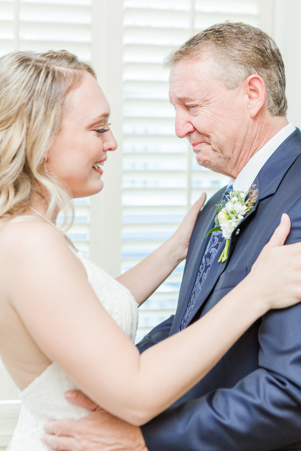 Father of the bride is captured crying as he sees his daughter for the first time. Captured by best New England wedding photographer Lia Rose Weddings.