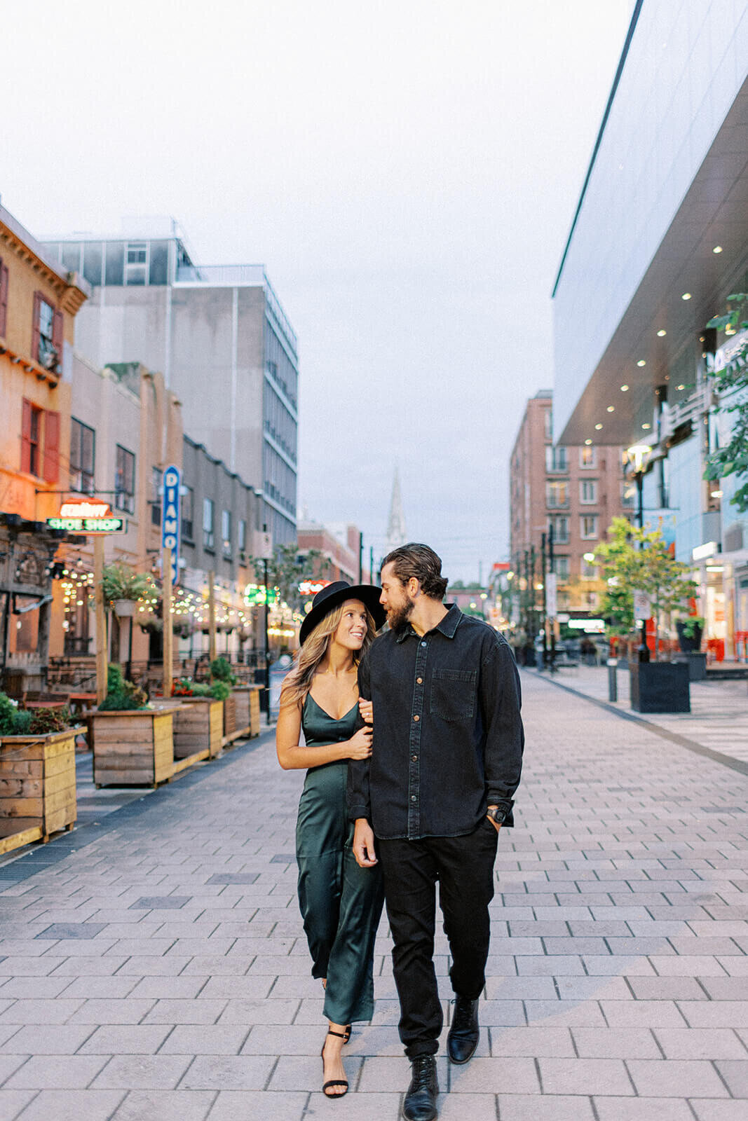 couple-link-arms-downtown-Halifax