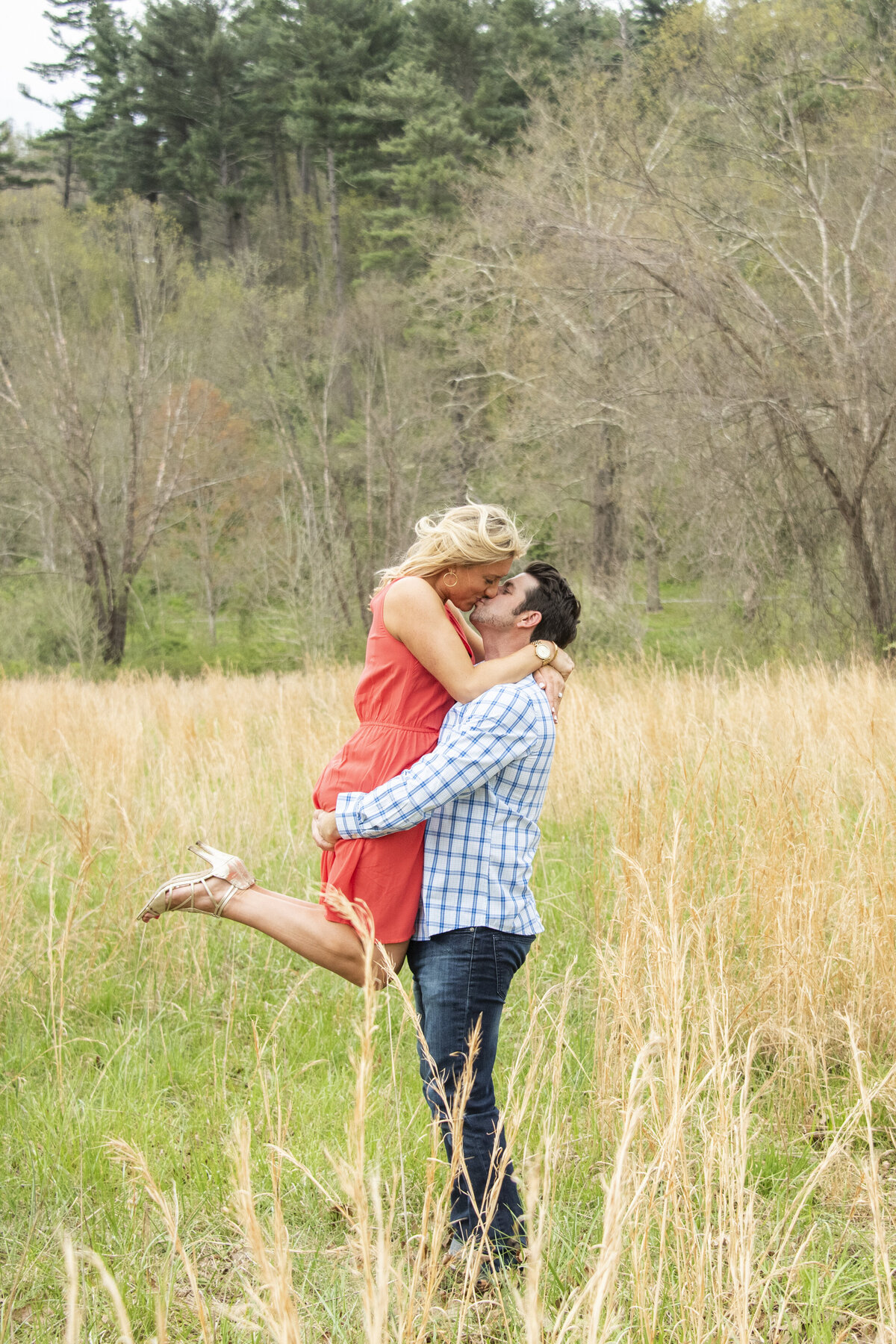 Biltmore Estate engagement photography couple kissing tall grass Asheville NC