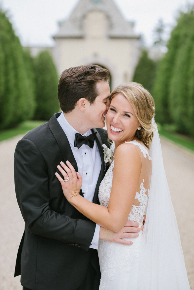 oheka castle wedding love classic happy candid bright clean bride and groom black tie event bow tie giggle sweet moment
