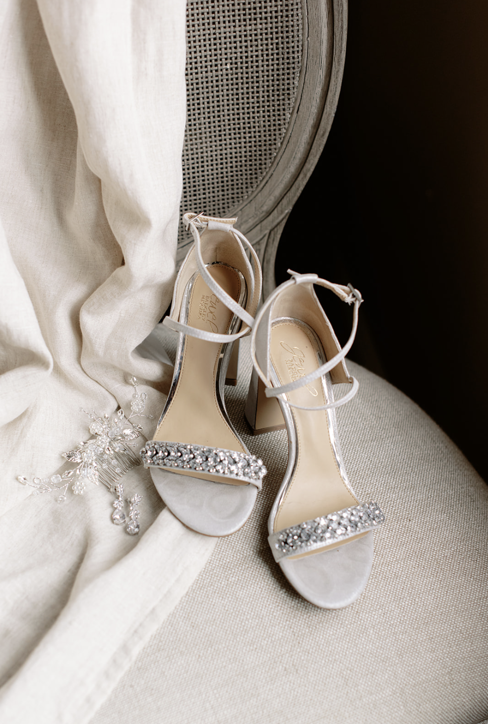 Elegant sparkly high heels are pictured with elegant bridal hair piece at Chicago wedding ceremony.
