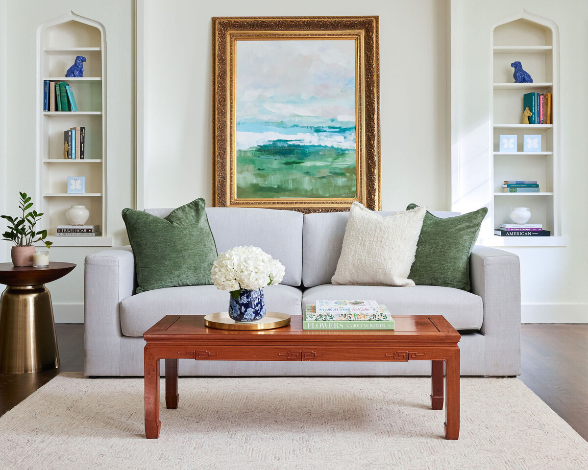 cocoloba homes cockrell ave living room with wooden coffee table and gray sofa