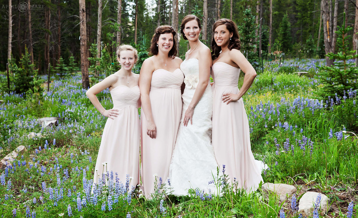 Bridesmaid photography in the woods with wildflowers in Breckenridge Colorado