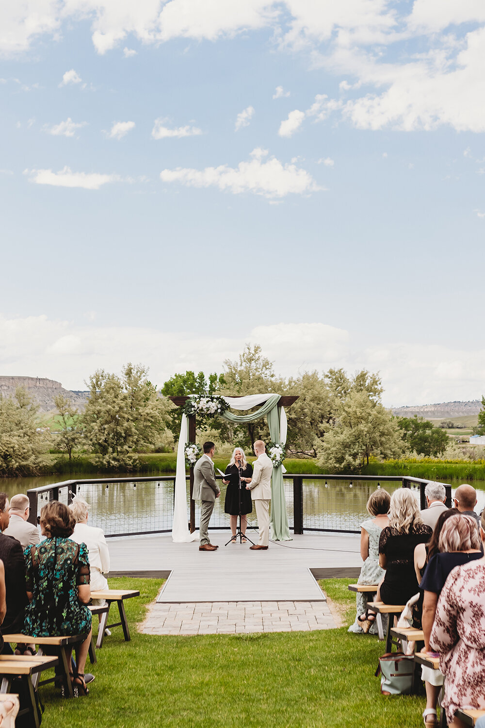 Grooms during wedding ceremony for sage mountain wedding at Camelot Ranch.