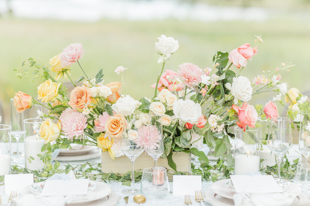 Wedding table scape featuring bright blooms