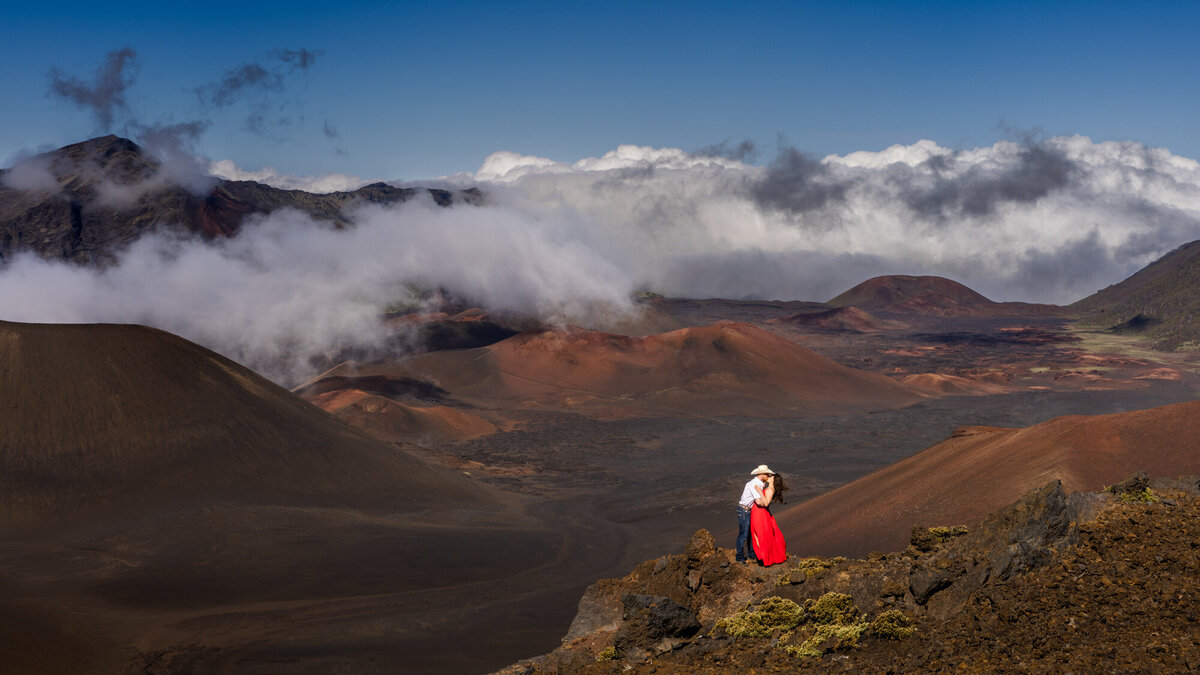 couple embracing in front of mountains