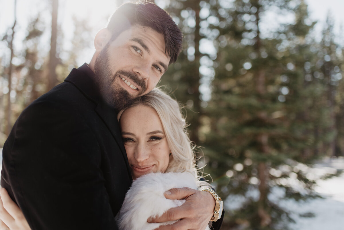 Jackson Hole Photographers capture groom hugging bride