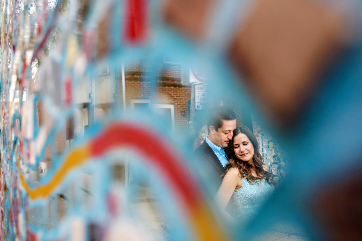 Reflection of an engaged couple in the mirrors of south street.