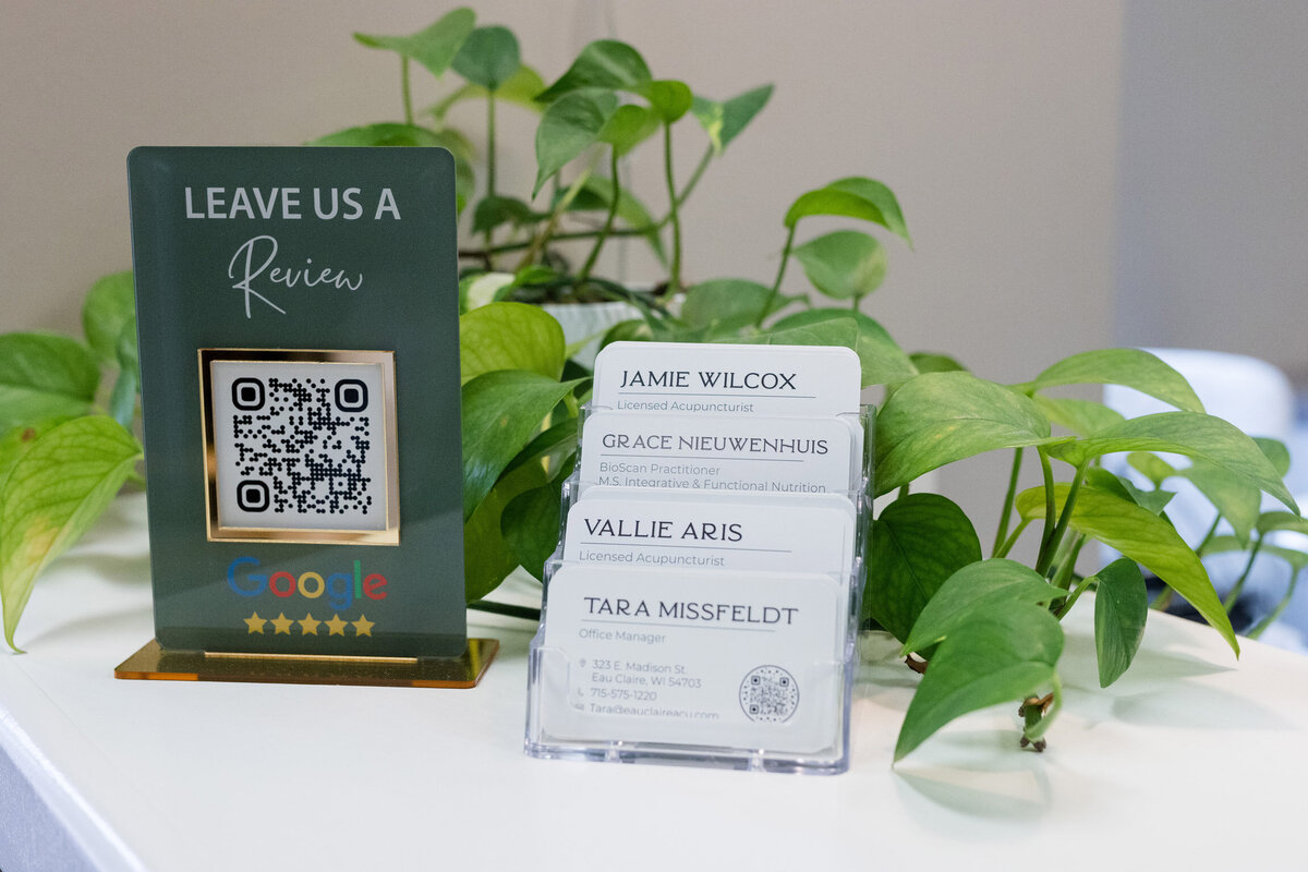 Stack of business cards, one for each member of the team.