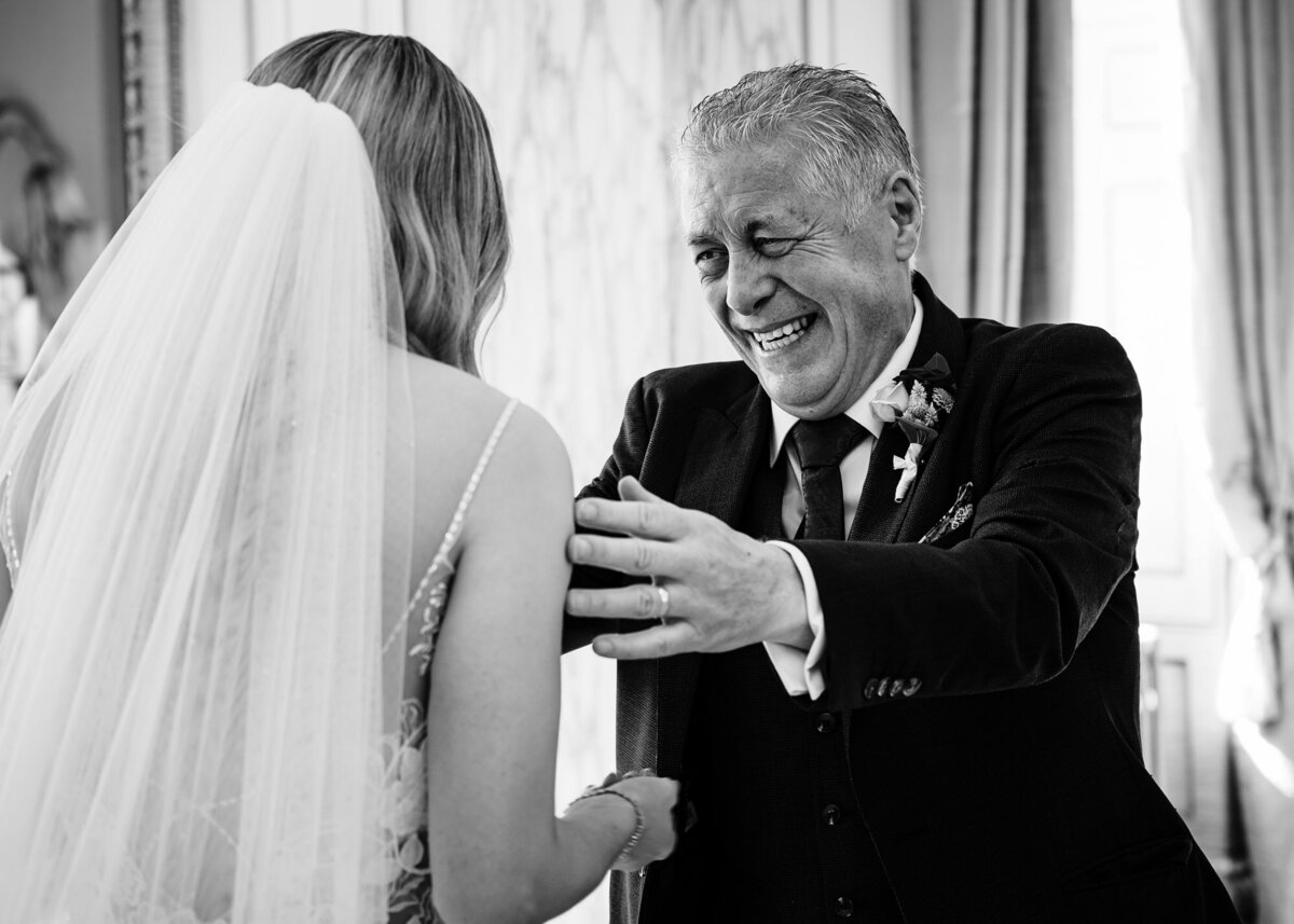dad seeing his daughter in her dress for the first time
