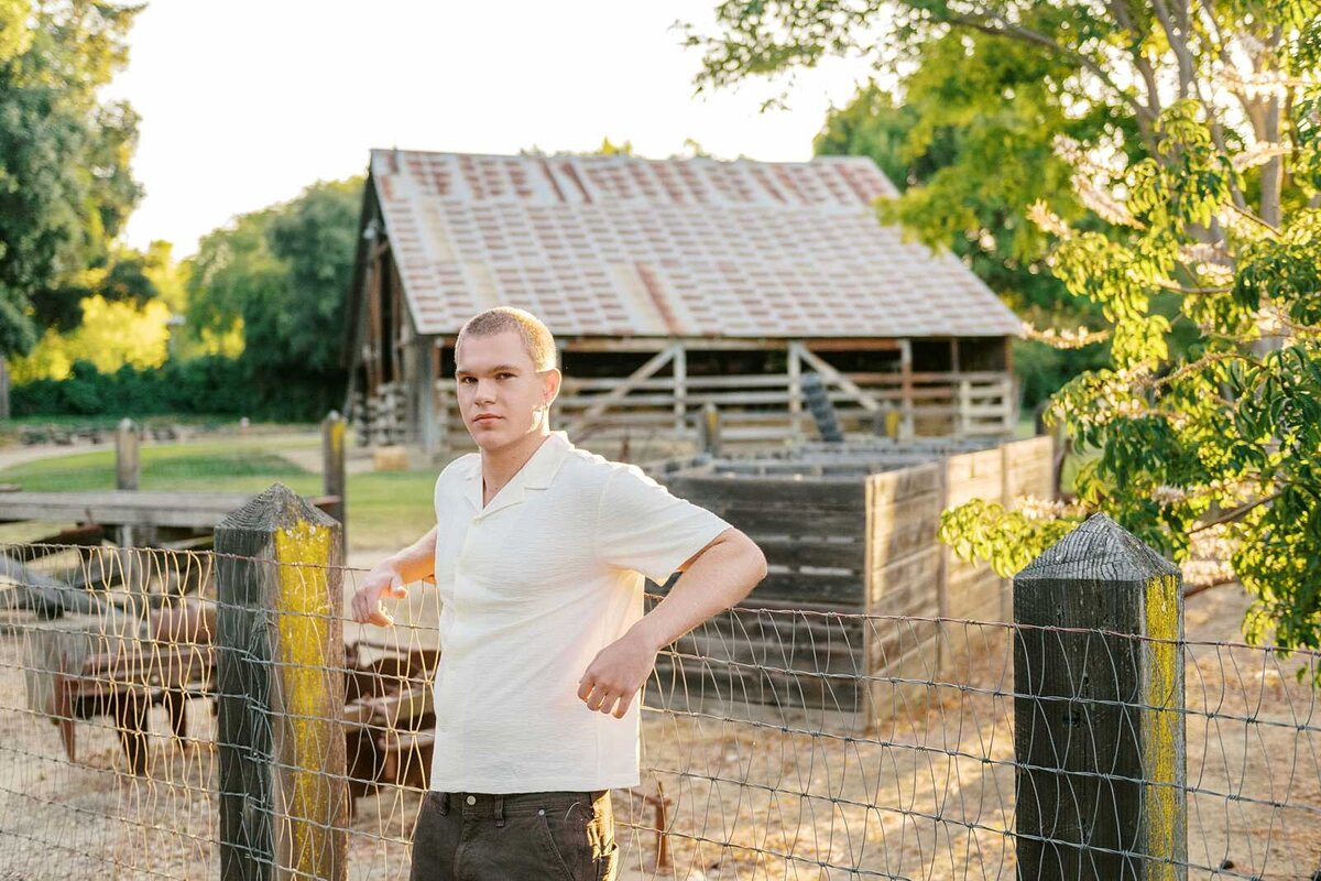 Senior guy photos with a barn in the background