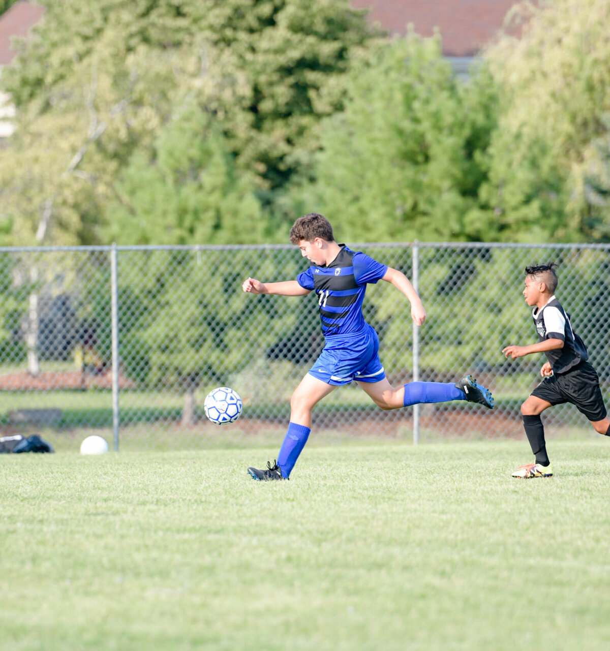 male soccer player kicking