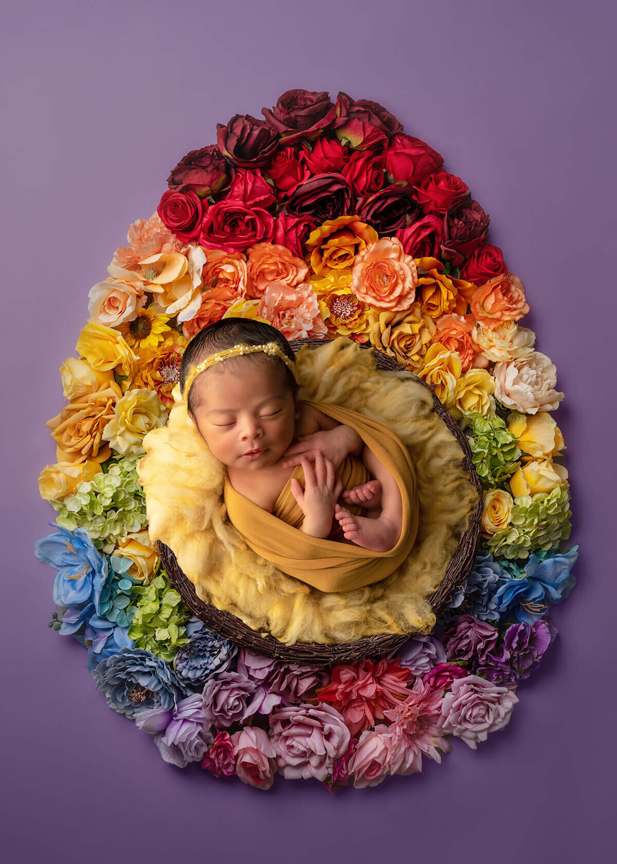 Newborn Baby laying on  flower egg