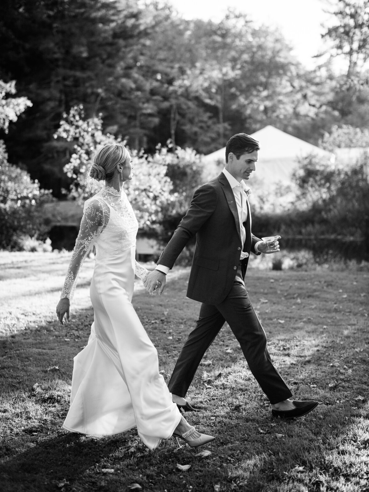 bride and groom walking at their private home wedding in connecticut
