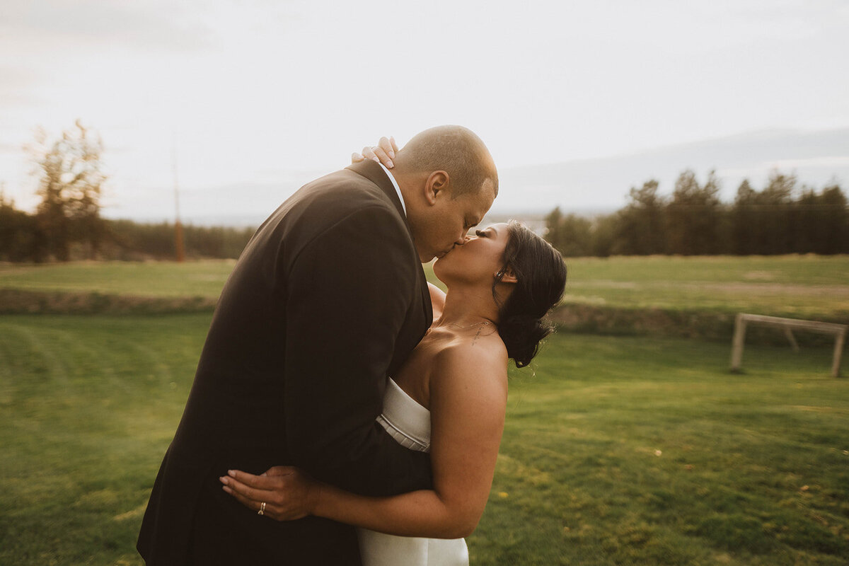 Idaho wedding photography gallery photo of newlyweds kissing during their spokane wedding reception