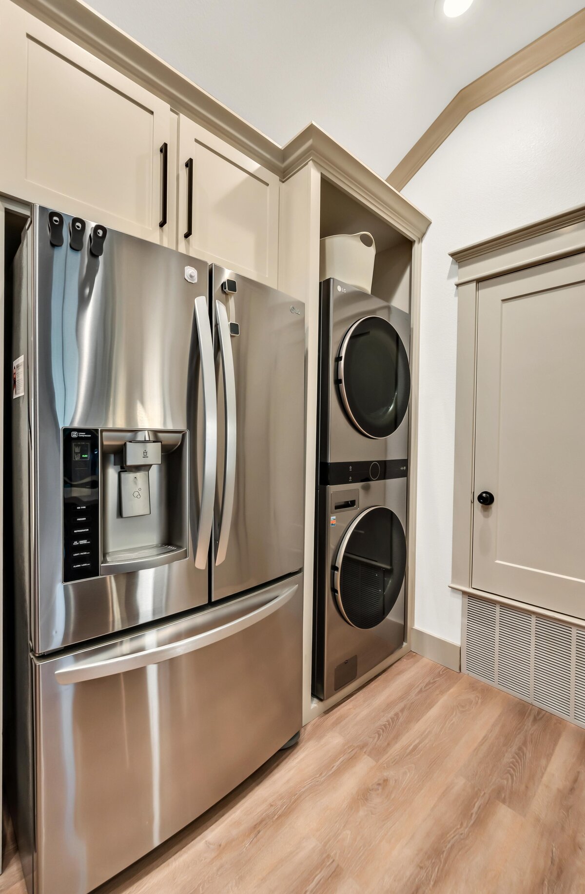 Laundry area with washer and dryer in this three-bedroom, three-bathroom vacation rental home with free wifi, outdoor theater, hot tub, propane grill and private yard in Waco, TX.