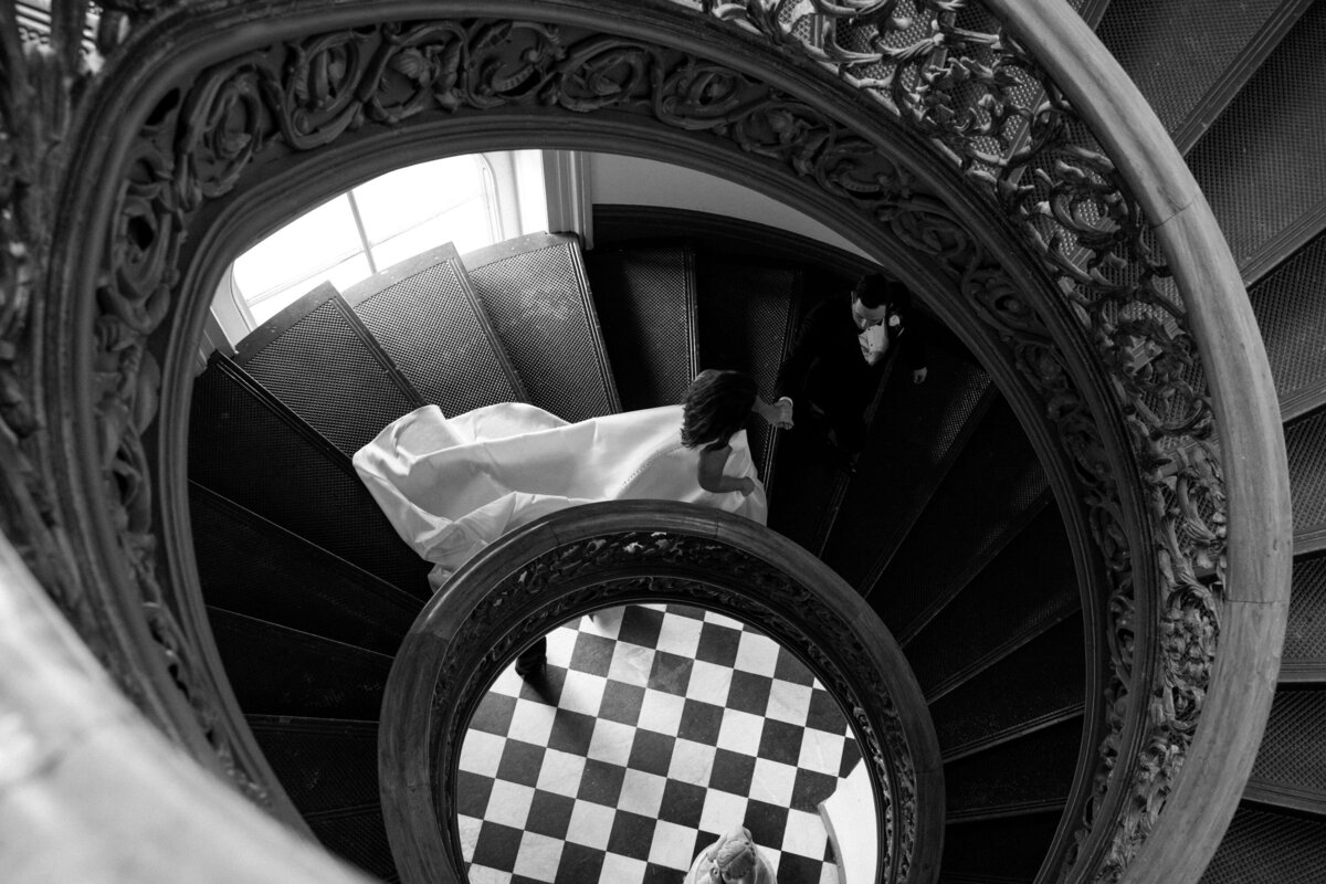 Event-Planning-DC-Baltimore-Wedding-George-Peabody-Library-Staircase-Couple-B&W-Anna-Lowe-Photography
